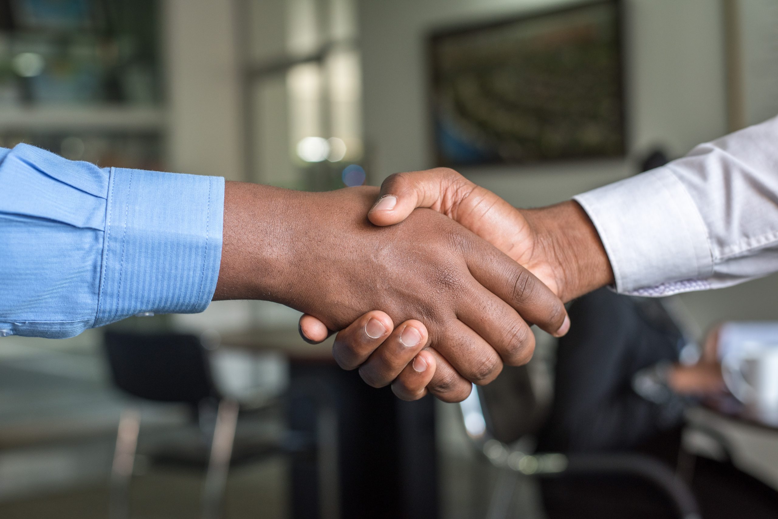 Two men shaking hands doing business
