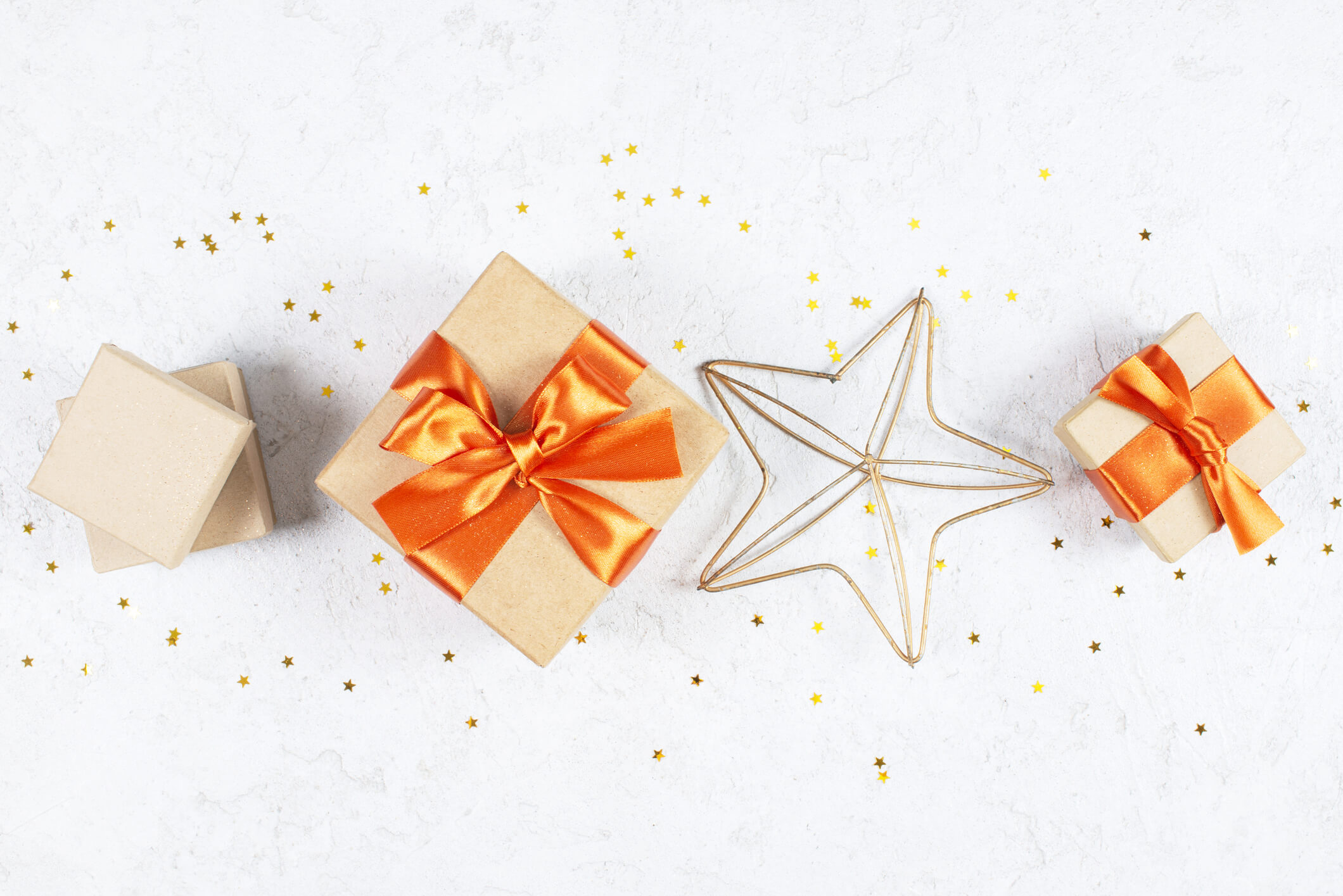 Festive image featuring gift boxes and stars